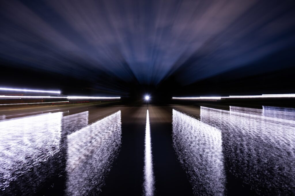 GA4 Search Console API 연동 - Abstract light streaks in a dark tunnel with reflections