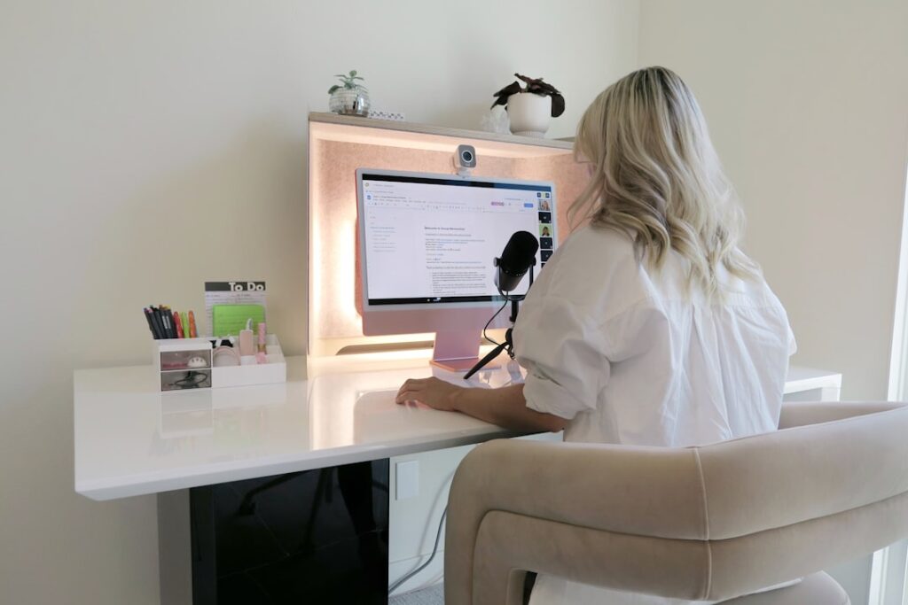 Gemini 1.5 Pro - a woman sitting at a desk with a computer